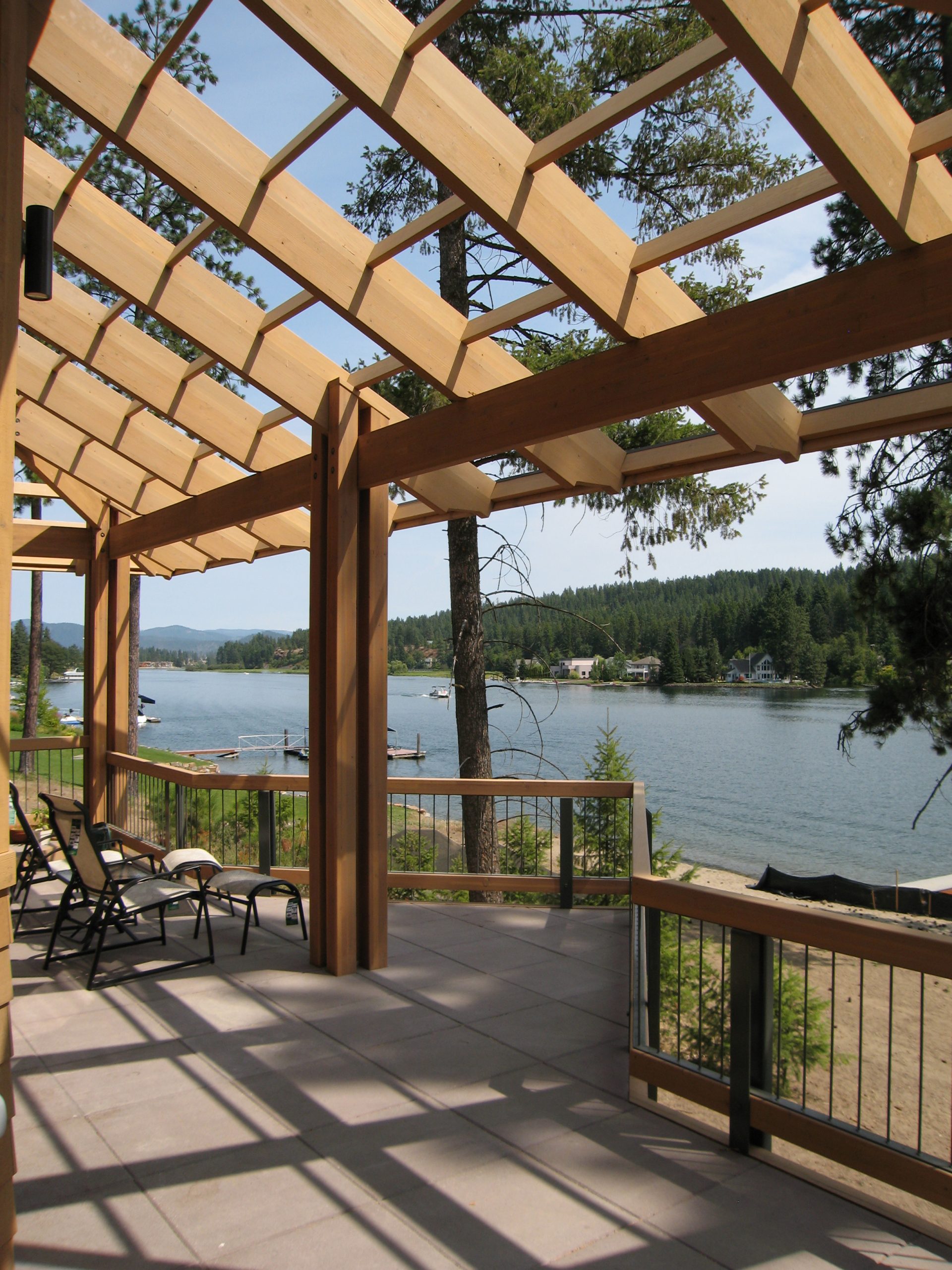 River residence is a custom home located in a beautiful waterfront setting on the Spokane River. The home features vaulted, wood-decked ceilings and a multitude of windows capturing the river views from almost every room.