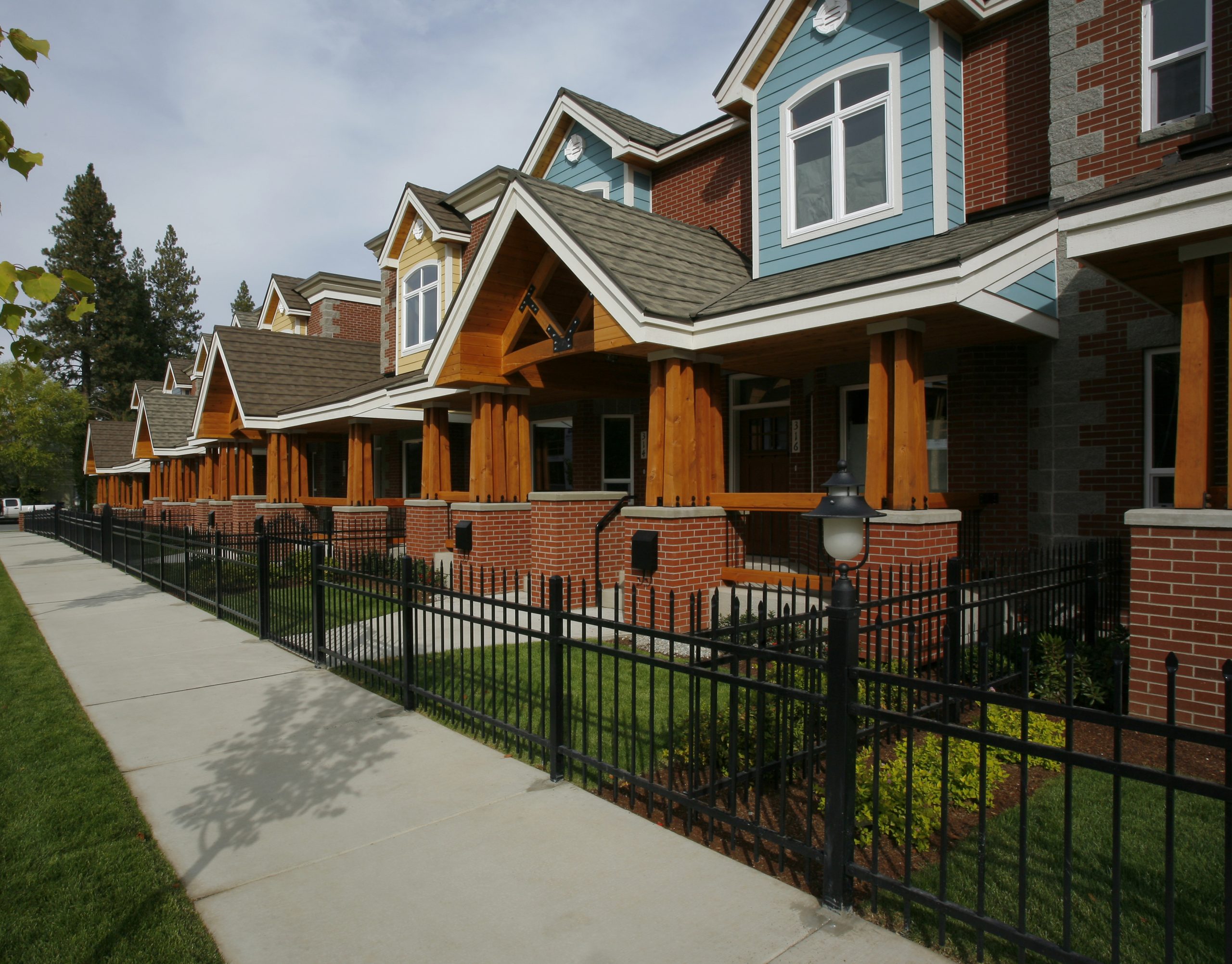 Ice Plant, located in downtown Coeur d'Alene, Idaho includes street front porches and tree lined streets to provide a sense of community and enhance the existing urban neighborhood fabric of the surrounding area.