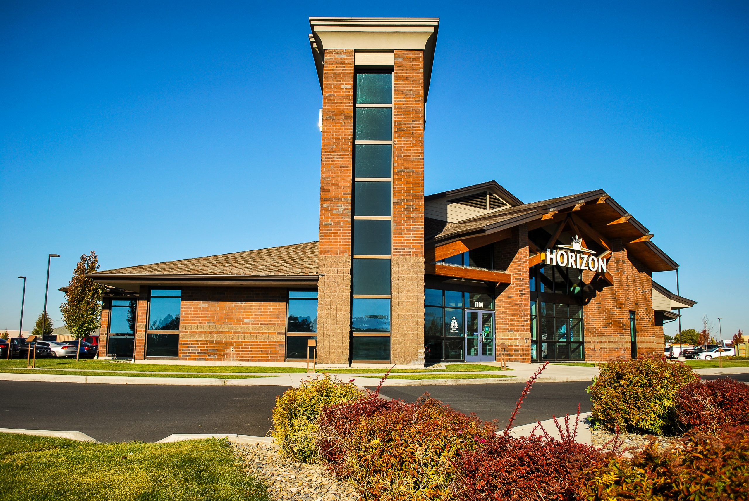 A new building for the Moses Lake, Washington branch of Horizon Credit Union the features an iconic tower element, exposed timber roof structure, and skylights.