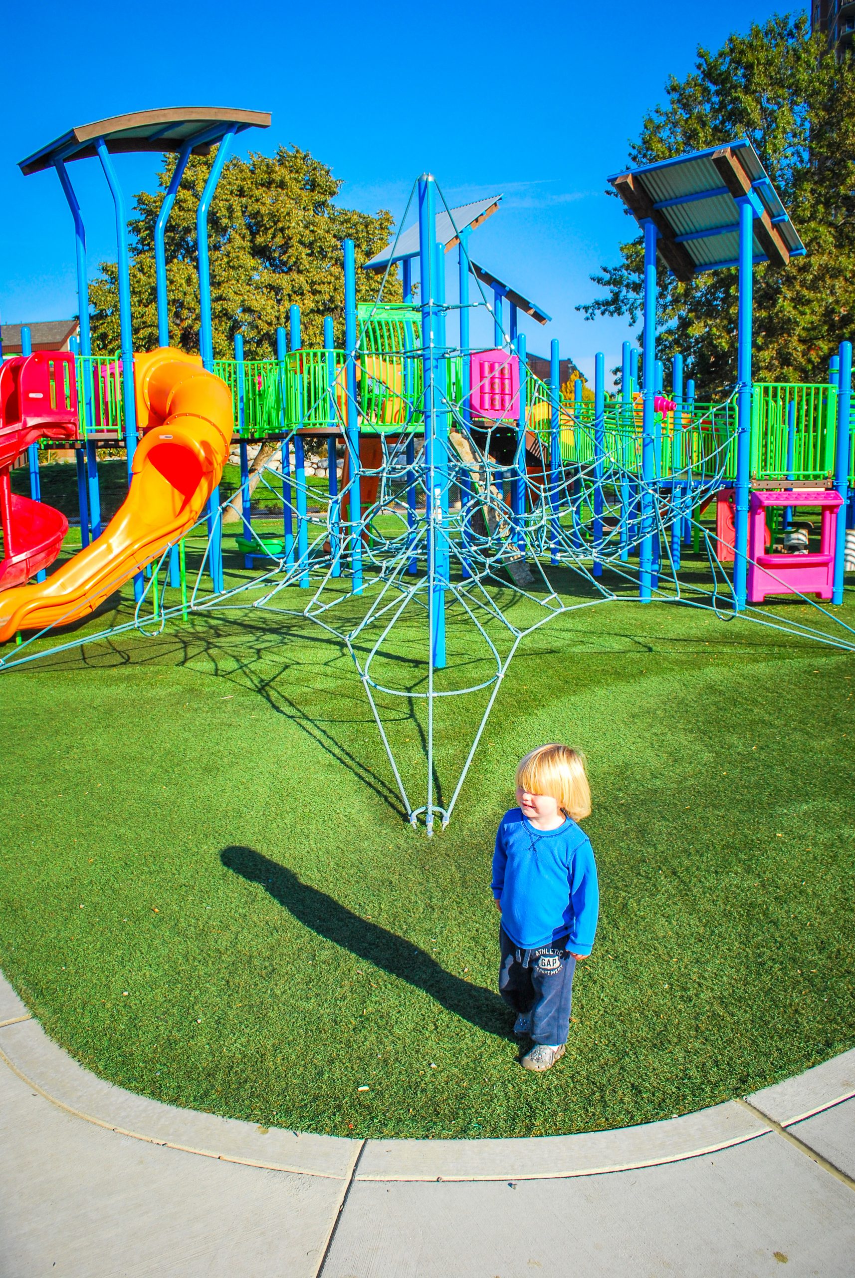 The McEuen Park Redevelopment was a collaborative project that features an ADA playground, splash pad, bike/pedestrian paths, open green space, grand pavillion, restrooms, dog park, subterranean parking structure, hardscape courts, lighting, and public art.