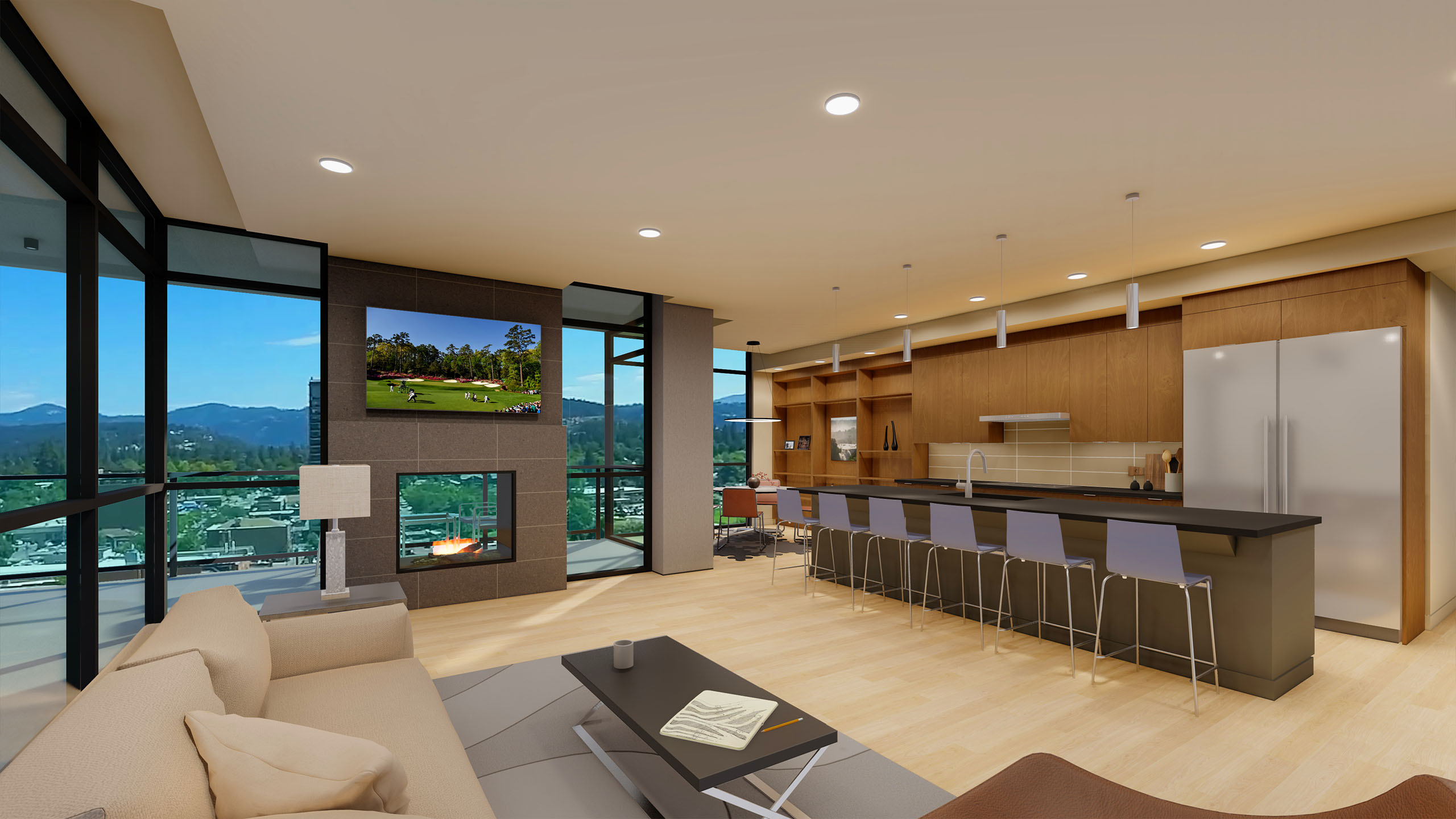 Open-concept living space in a Thomas George condo, featuring a modern kitchen, fireplace, and panoramic views of Coeur d’Alene through floor-to-ceiling windows.